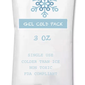 May include: White gel cold pack with a snowflake design. The pack says "GEL COLD PACK" and "3 OZ". It also says "SINGLE USE", "COLDER THAN ICE", "NON TOXIC", and "FDA COMPLIANT".