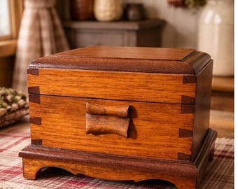 Vintage wood wooden jewelry or trinket box, featuring engraved flowers on the lid.
