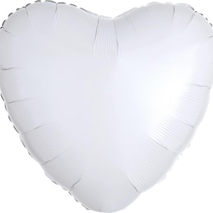 May include: A white heart-shaped balloon, likely made of foil, with a reflective surface. The balloon is inflated and has a seam around the edges. The heart shape is clearly defined, perfect for Valentine's Day or other celebrations.