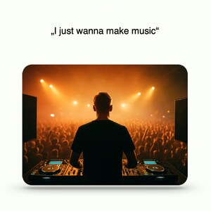 May include: A DJ at a mixing console, facing a crowd in a concert setting. The stage is lit with bright orange lights. The text "I just wanna make music" is above the image.