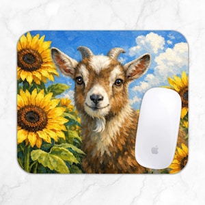 May include: A rectangular mouse pad featuring an oil painting style illustration of a brown and white goat centered among vibrant yellow sunflowers against a bright blue sky with white clouds. A white computer mouse rests on the right side.