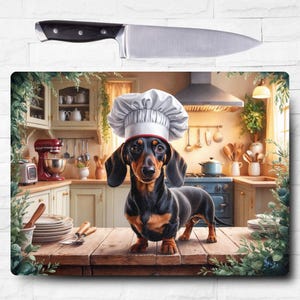 May include: A black and tan dachshund wearing a white chef's hat stands in a kitchen setting. The dog is looking directly at the camera. The kitchen features a red stand mixer, a wooden countertop, and a variety of kitchen utensils.
