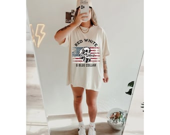 May include: A white oversized t-shirt with a red, white, and blue American flag graphic and the text "RED WHITE & BLUE COLLAR".