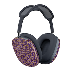May include: Over-ear headphones with a purple and gold patterned ear cup design. The headphones have a dark gray headband and ear cushions. The ear cups are decorated with the Greek letters ΩΨΦ.