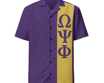 May include: Purple short-sleeved button-down shirt with a yellow vertical stripe on the left side. The stripe features the Greek letters Omega, Psi, and Phi in purple. The shirt has a classic collar and black buttons.