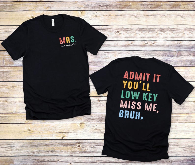 a couple of t - shirts sitting on top of a wooden floor