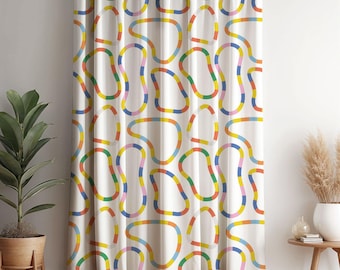 May include: A floor-length curtain featuring an off-white background with a repeating pattern of irregular, rounded shapes outlined in segmented bands of primary and secondary colors including red, orange, yellow, green, blue, and pink.