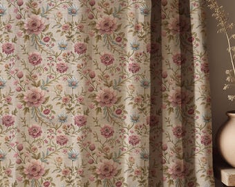 May include: A curtain panel featuring a repeating floral pattern with pink roses, small blue flowers, and green vines on a light beige, textured fabric background. The fabric hangs in vertical folds, displaying a dense botanical print.
