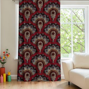 May include: A patterned curtain with a repeating fan-like design. The fans are primarily burgundy with brown and blue-gray accents. The curtain hangs in front of a window, with a white couch visible.