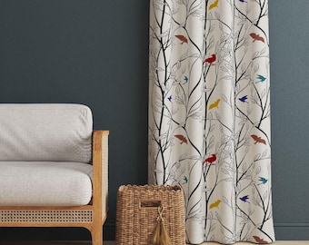 May include: A floor-length curtain featuring a white background with a black line-art pattern of tree branches and leaves, accented by small, solid-colored birds in red, yellow, blue, and brown scattered throughout the fabric design.