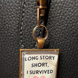 Tay Song Long Story Short Lyrics “Long Story Short I Survived” Copper Square Charm Locket Bag Charm Purse Charm Blonde Pop Singer Bag Clip