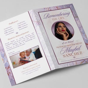 Peut inclure: Un programme funéraire floral violet et blanc avec une photo d'une femme et le texte "Se souvenir de la vie de notre bien-aimée Mère, Sœur, Amie Maybel Sanchez".