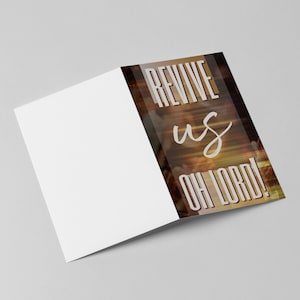 May include: A folded card with a blurred image of a crowd of people with their hands raised in the air. The text "REVIVE US OH LORD!" is printed in white on a brown background.
