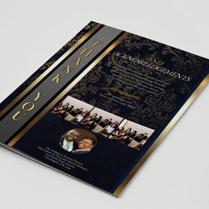 May include: A folded card with a navy blue and gold design. The card features the words "THANK YOU" in gold lettering and a decorative floral pattern. The inside includes text and photos of people.