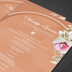 May include: Peach-colored Worship Service program with floral accents. The program includes the text "Worship Service" and various sections such as "Welcome & Introduction," "Prayer," and "Sermon." Floral arrangements of white lilies and pink roses adorn the right side.