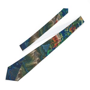 May include: A necktie featuring a detailed, colorful topographic map print. The design displays winding blue rivers, brown mountain ranges, green forested areas, and small grid-like patterns in shades of red, yellow, and blue against a dark background.