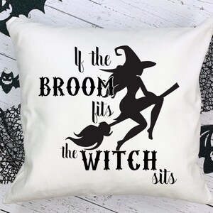 May include: White throw pillow with black text that reads "If the broom fits the witch sits". A black silhouette of a witch riding a broom is in the center of the pillow.
