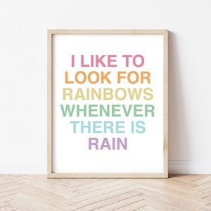 May include: A framed print with the text "I like to look for rainbows whenever there is rain" in rainbow colors.