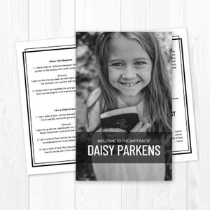 May include: A black and white photo of a young girl smiling and holding a book. The text "WELCOME TO THE BAPTISM OF DAISY PARKENS" is at the bottom of the photo.