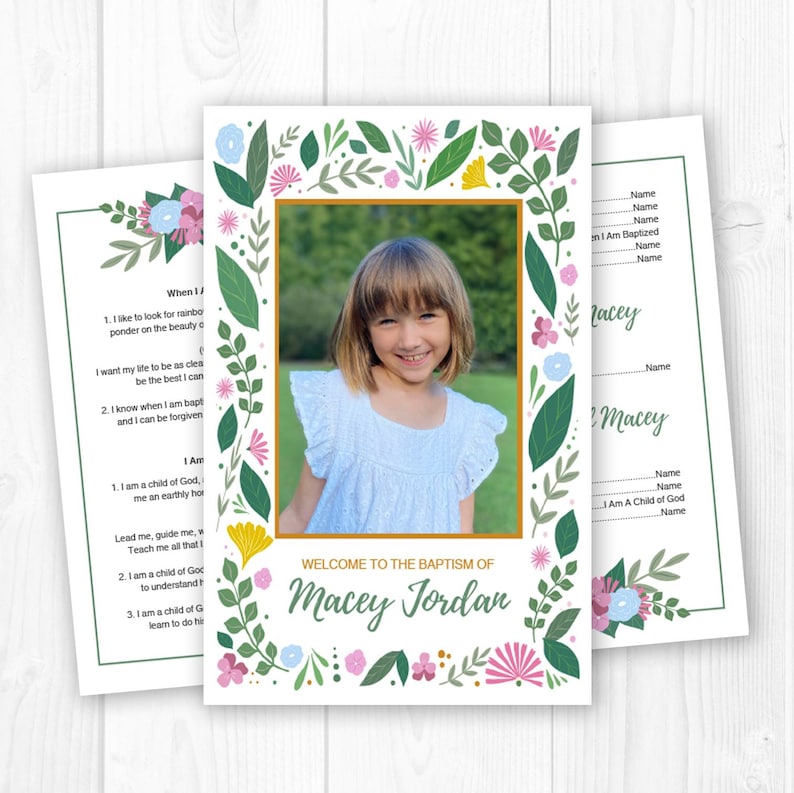 May include: Baptism invitation featuring a photo of a smiling child, framed with a gold border. The invitation is decorated with floral and leaf illustrations in pink, blue, and green, with the text "Welcome to the Baptism of Macey Jordan."
