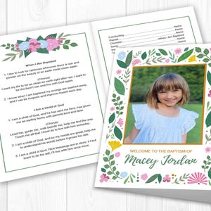 May include: A baptism invitation featuring a photo of a smiling child framed by a floral border. The text "Welcome to the Baptism of Macey Jordan" is displayed below the photo. The open invitation also includes a poem with floral accents.
