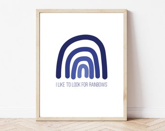 May include: A framed print with a blue ombre rainbow and the text "I like to look for rainbows".