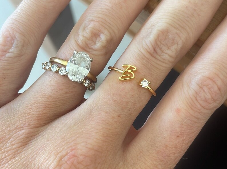 Gold adjustable ring with personalised name initial with cubic zirconia accent. stackable jewellery. Oval Diamond Ring partnering.
