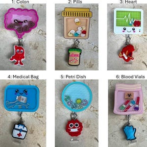 May include: A collection of medical-themed badge reels. The reels feature various designs, including a colon, pills, a heart monitor, a medical bag, a petri dish, and blood vials. Each reel has a unique charm and a retractable cord.