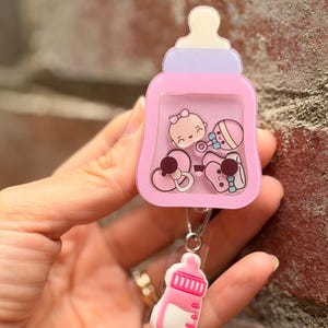 3D Floating Emoji Badge Reel: Medical ID Clip for Nurse, Doctor, Midwife, Student 7. Baby Bottle