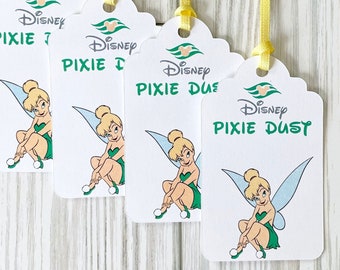 May include: Four white gift tags with a scalloped top, each featuring a Disney logo and a cartoon image of Tinkerbell. The tags have yellow ribbons and the words "Pixie Dust" and "Pixie Dust" printed in green.