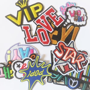 May include: A collection of colorful iron-on patches featuring words like "VIP", "Love", "Star", and "Who Cares!" The patches are perfect for adding a personalized touch to clothing, bags, or other accessories.