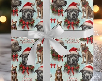 Può includere: Carta da regalo blu e bianca con un motivo ripetuto di cani che indossano cappelli di Babbo Natale e il testo "One Little Christmas" e "Have Yourself a Merry Little Christmas".