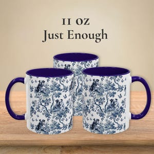 May include: Three 11 ounce ceramic mugs with a blue and white floral pattern featuring a bulldog design. The mugs have a blue rim and handle.