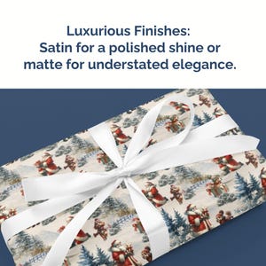 May include: Christmas-themed wrapping paper with a festive design featuring Santa Claus figures, snow-covered trees, and a white ribbon tied in a bow. The text reads "Luxurious Finishes: Satin for a polished shine or matte for understated elegance."