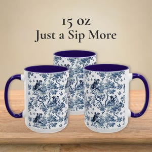 May include: Three 15 oz ceramic mugs with a blue and white pattern of bulldogs and butterflies. The mugs have a blue rim and handle.