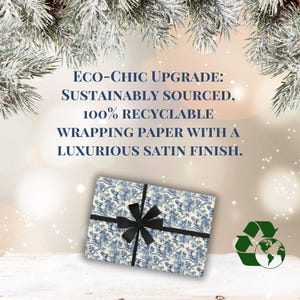 May include: A blue and white patterned gift box with a black satin ribbon. The box is sitting on a white surface with a green recycling symbol in the background. The text on the image reads: "ECO-CHIC UPGRADE: SUSTAINABLY SOURCED, 100% RECYCLABLE WRAPPING PAPER WITH A LUXURIOUS SATIN FINISH."