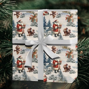 May include: A wrapped gift box with a white ribbon and bow. The wrapping paper features a vintage Christmas scene with Santa Claus, dogs, and snowy trees. The box is a square shape.