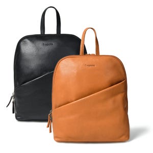 May include: Two leather backpacks, one black and one tan, are shown against a white backdrop. Each backpack features a top handle, a front zipped pocket, and the word "Ereganto" embossed on the front. The tan backpack has a lighter brown zip.