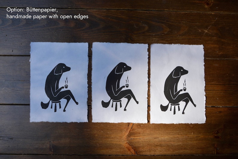May include: Three black and white illustrations of a dog sitting on a stool and holding a cup of coffee. The illustrations are printed on handmade paper with open edges.