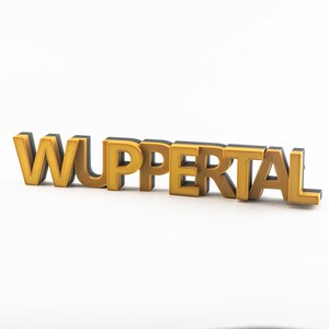 May include: Gold 3D letters spelling out the word "WUPPERTAL" on a white background.