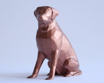May include: A copper-colored, geometric, 3D printed dog figurine. The dog is sitting with its head tilted down and its tail tucked between its legs.