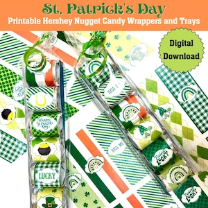 May include: Printable Hershey's Nugget candy wrappers and trays for St. Patrick's Day. The wrappers feature green, white, and orange stripes with shamrocks, rainbows, and leprechauns. The trays are clear plastic and have a green and white striped design. The text on the wrappers includes "Happy St. Patrick's Day", "Kiss Me", "Feeling Lucky", and "Lucky".