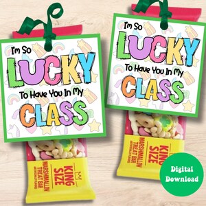 May include: Two gift bags with tags that read "I'm So Lucky To Have You In My Class." Each bag contains a marshmallow treat bar. The tags have colorful text and are decorated with rainbows and stars. A green circle with "Digital Download" is on the right.