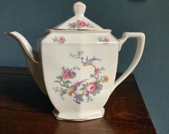 Porcelaine Cerabel teapot with birds and flowers.