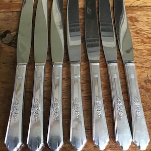 Simeon and George Rogers Company set of 7 silver-plated knife handles.
