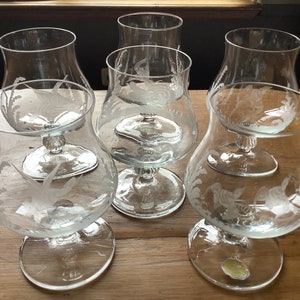Set of 6 crystal cognac glasses with etched birds.