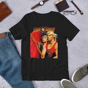 Shirt - Flash Gordon - 1980 space opera by Mike Hodges. Stars Sam J. Jones, Melody Anderson, Ornella Muti, Max von Sydow and Topol. V4