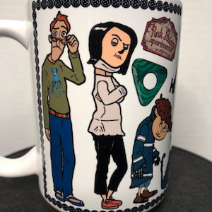 May include: White ceramic mug featuring cartoon illustrations of characters. The mug has a black button border and the words "Pink Palace Apartments" are visible. The characters are in various outfits and poses.