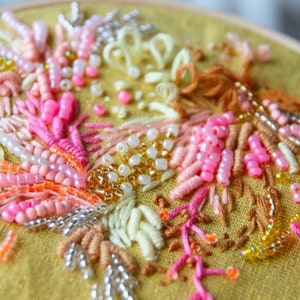 Close up of the 3D embroidery hoopart with beads and hand embroidery.