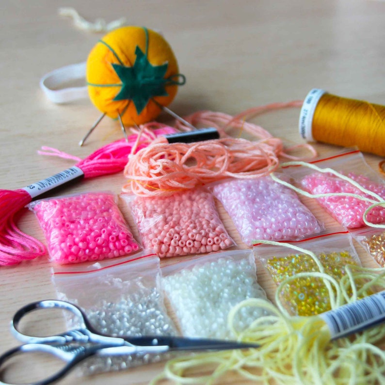 Beads and cotton threads used to hand make the embroidery piece.